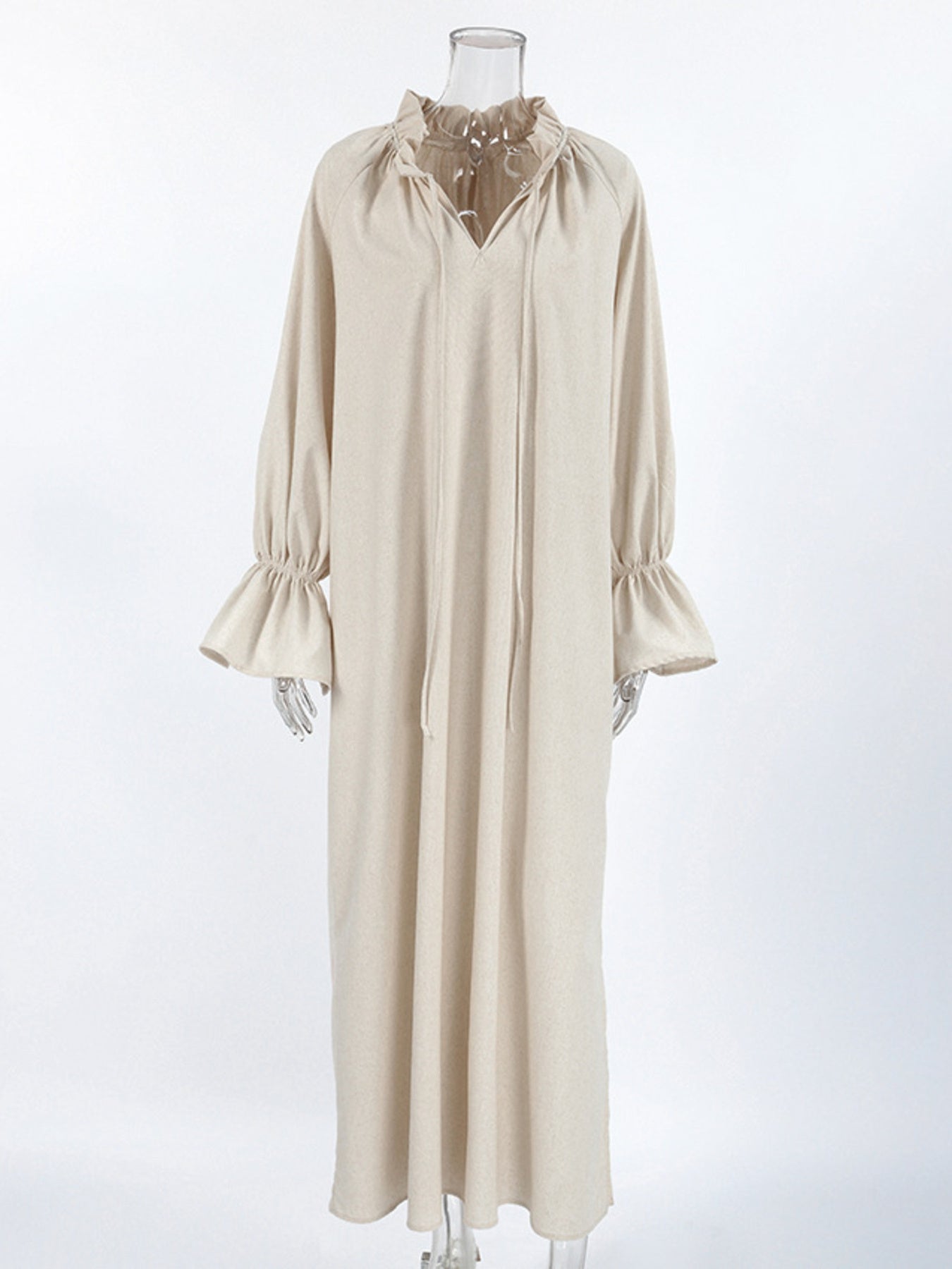 Beige cotton maxi dress with tie neck and ruffled cuffs