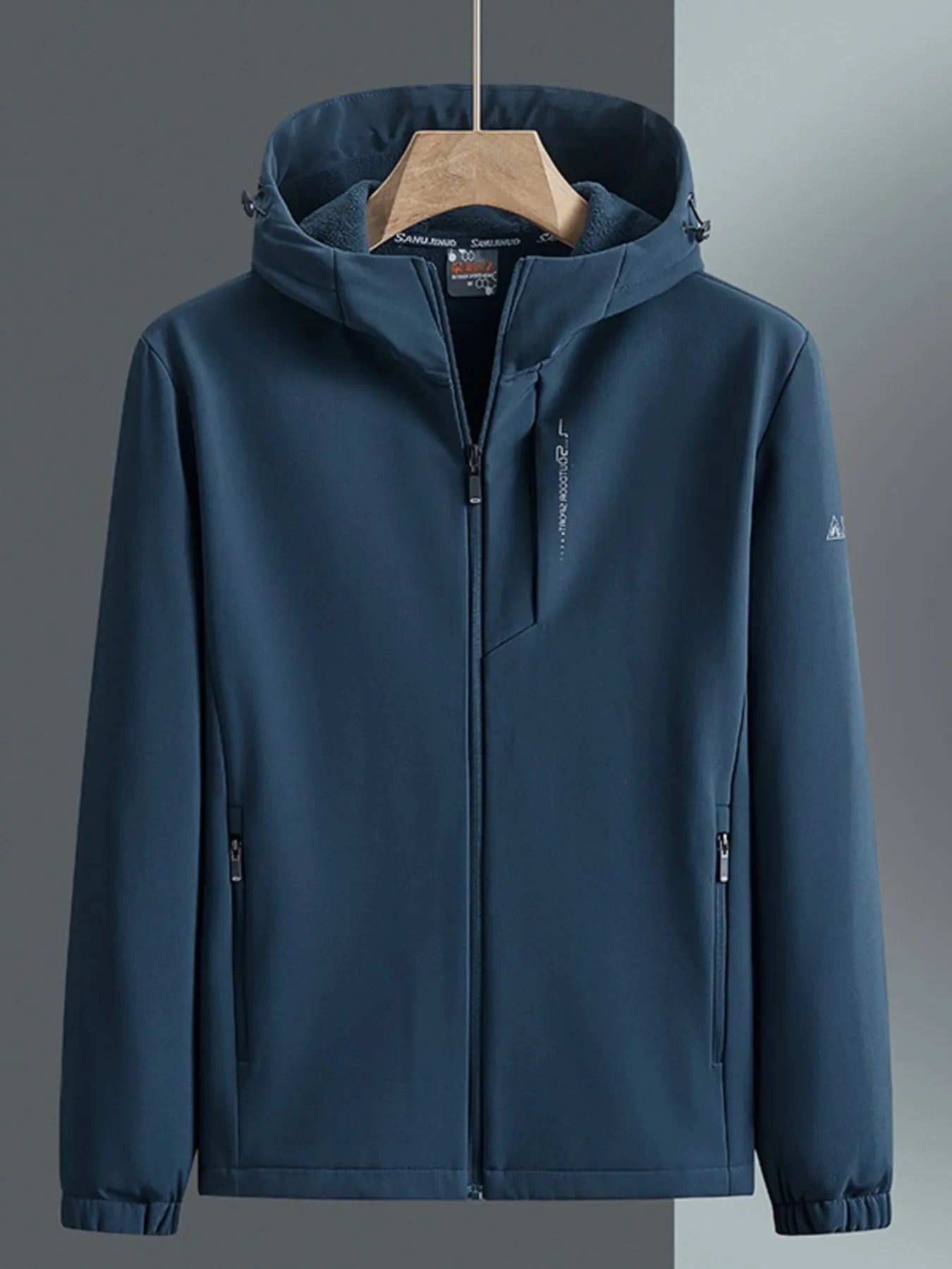 Men's hooded windbreaker in Peacock Blue with zippered pockets and subtle sleeve logo.