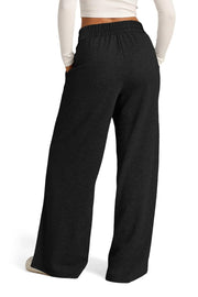 Black seamed palazzo lounge trousers with elastic waistband and pockets.