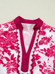 Floral print polyester blouse with V-neck and white lace trim detail
