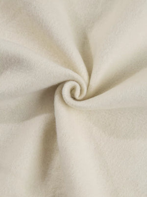 Beige cotton joggers with a soft, textured fabric detail.