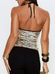 Shimmering sequin tiger print cami top with halter neck and black trim.