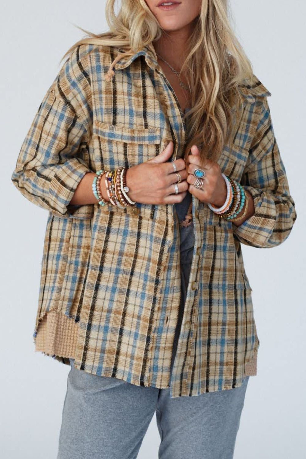 Textured plaid hooded overshirt with raw hem and button front.