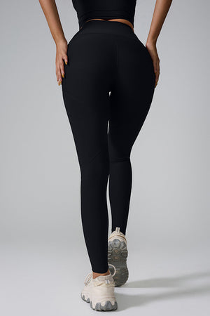 Black ribbed contour leggings with a high waist and sculpted fit.