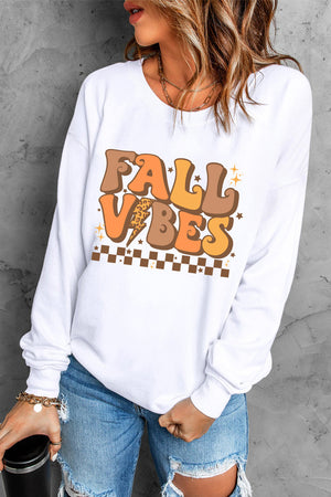 White crewneck sweatshirt with retro "Fall Vibes" graphic and checkered detail.