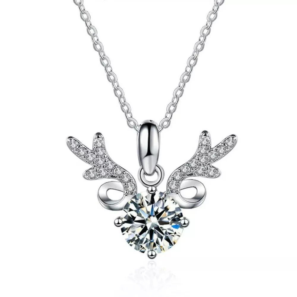 Sterling silver necklace with a moissanite diamond and antler charm.