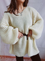 Cream oversized ribbed knit sweater with balloon sleeves and a belted waist.