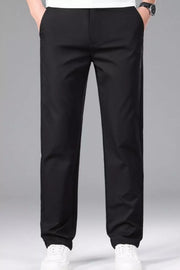Men's black slim-fit stretch dress pants with a basic style and smooth finish.