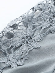 Light gray blouse with intricate lace yoke and sleeve details.