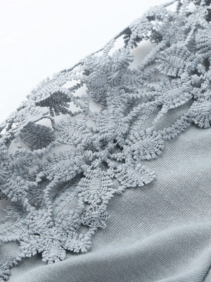 Light gray blouse with intricate lace yoke and sleeve details.