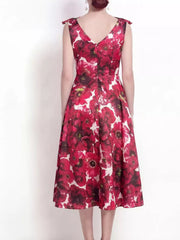 Floral midi dress with bow details on shoulders, V-neck, and a-line skirt.