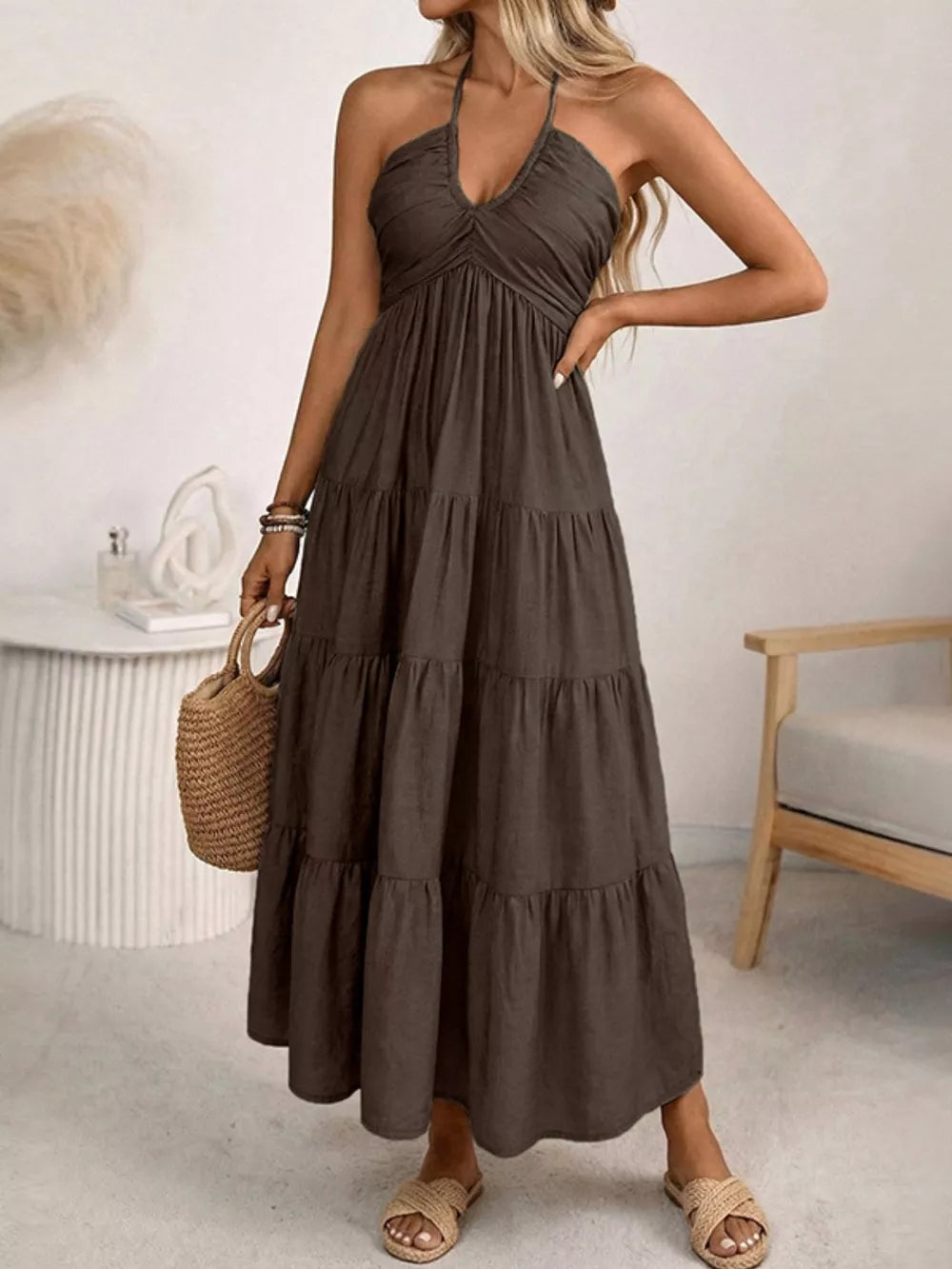 Dark brown smocked halter neck midi dress with tiered skirt.