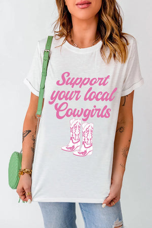 White graphic tee with rolled sleeves and pink cowgirl boots and text.