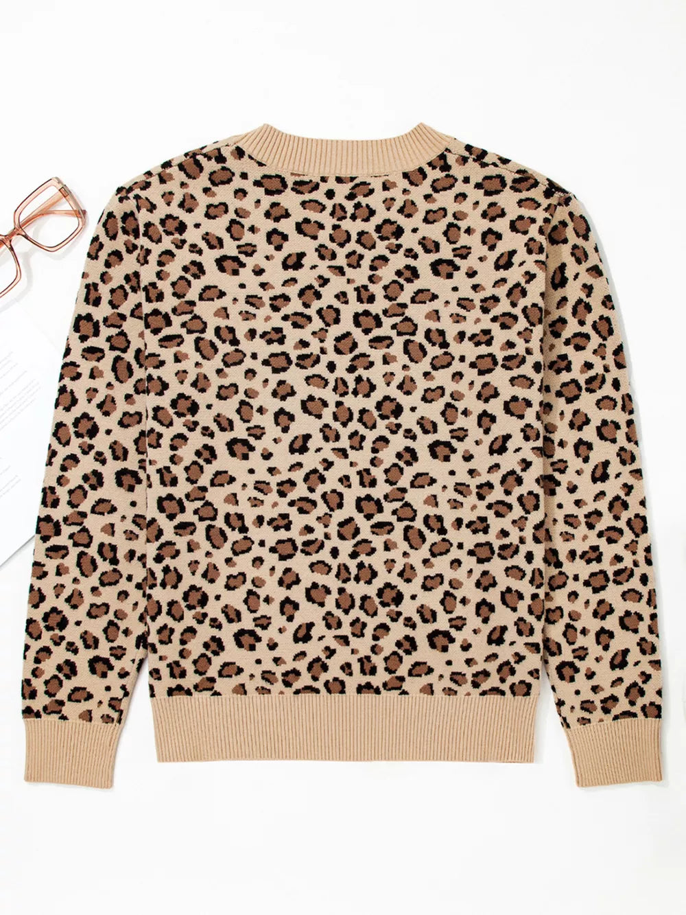 Savanna Spot Long Sleeve Knit Top in beige with animal print, crew neck, and ribbed cuffs and hem.
