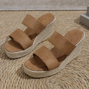 Camel suede platform wedge slides with rope-wrapped espadrille detail.