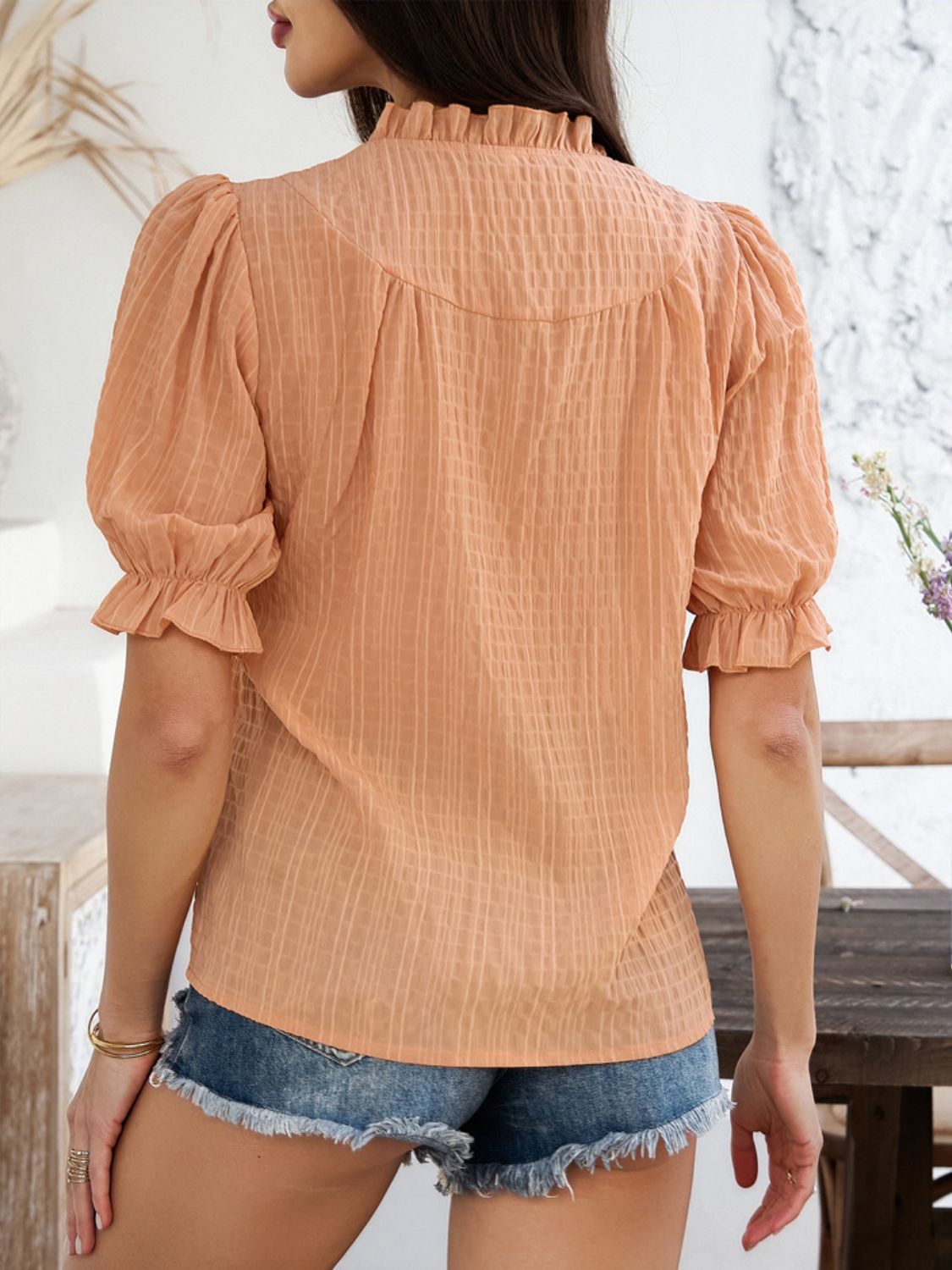 Sherbet textured puff sleeve blouse with ruffled neckline and cuffs