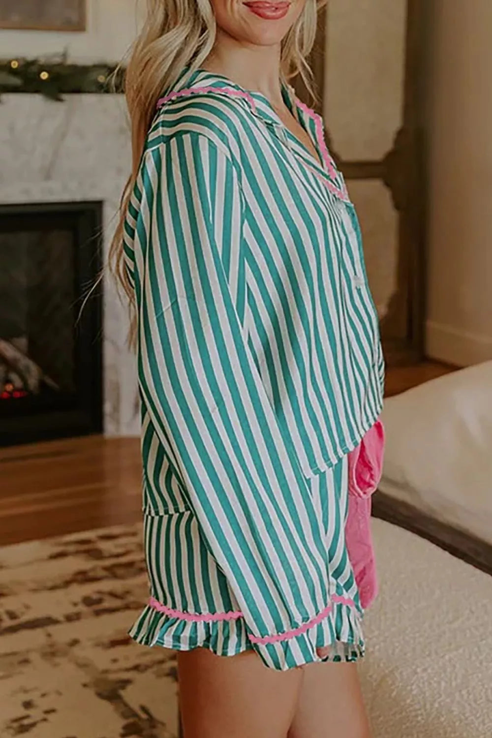 Green and white striped pajama set with pink ruffle trim and collar