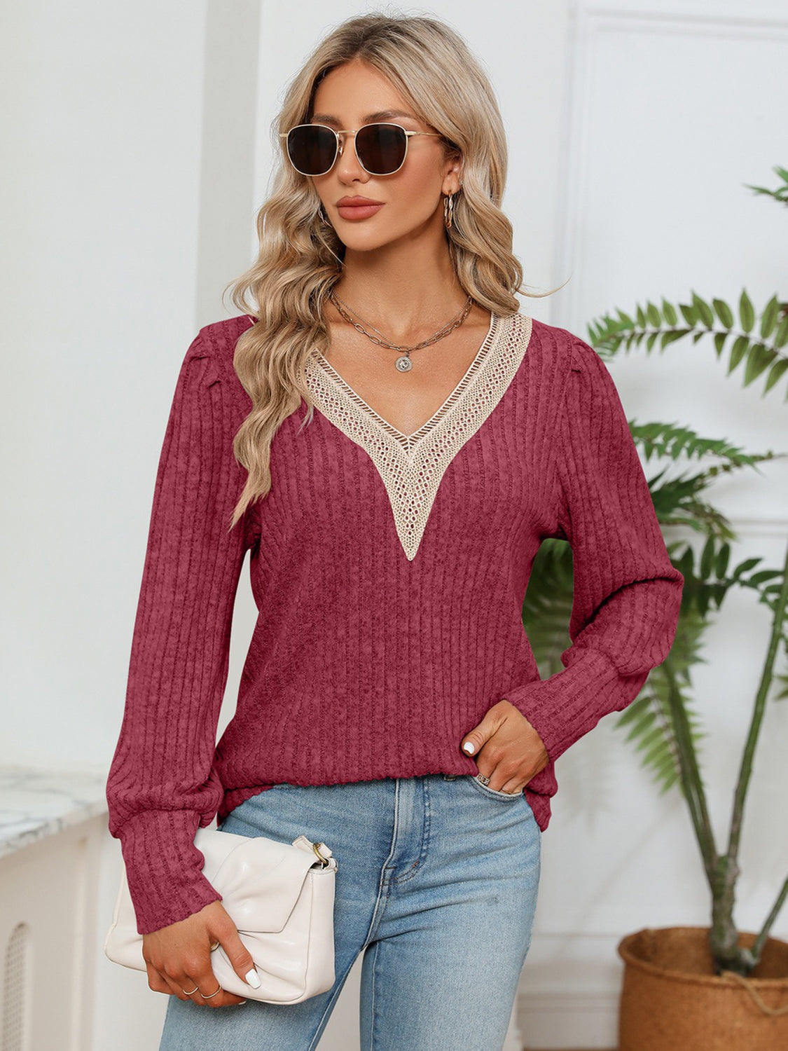 Brick Red ribbed knit sweater with crochet V-neck and long sleeves.