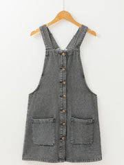 Gray faded denim pinafore dress with button front and two large front pockets.