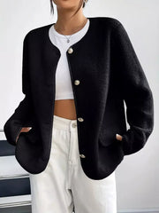 Black textured button-up fleece jacket with round neckline and ornate buttons.