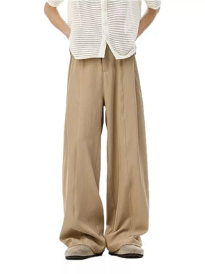 Men's khaki wide-leg track pants with front pleats and a relaxed fit.
