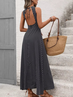 Black polka dot maxi dress with open back and tie detail, flattering silhouette
