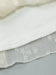White lace backless mini dress with asymmetrical hem detail