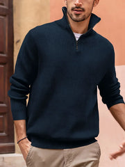 Navy ribbed quarter-zip pullover sweater with a stand-up collar and zipper detail.