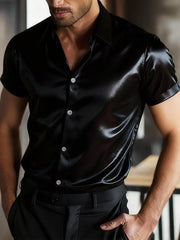 Black satin short sleeve shirt with button front and tailored fit.
