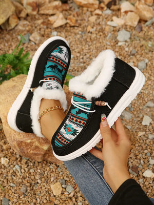 Southwestern print faux fur lined loafers in black with white trim and white soles.