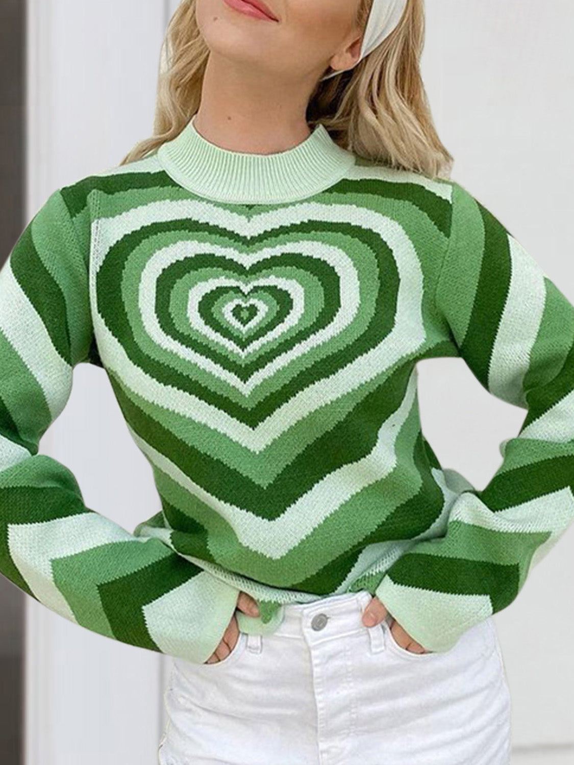 Light green mock neck sweater with heart stripe pattern and long sleeves