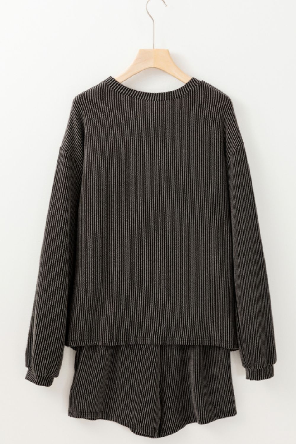 Dark gray ribbed lounge set with a graphic baseball detail, crew neck, and long sleeves.