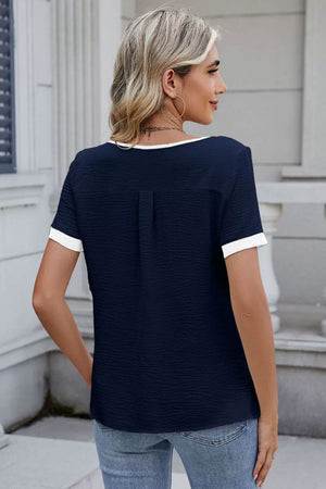 Dark Navy textured blouse with contrast trim and short sleeves.