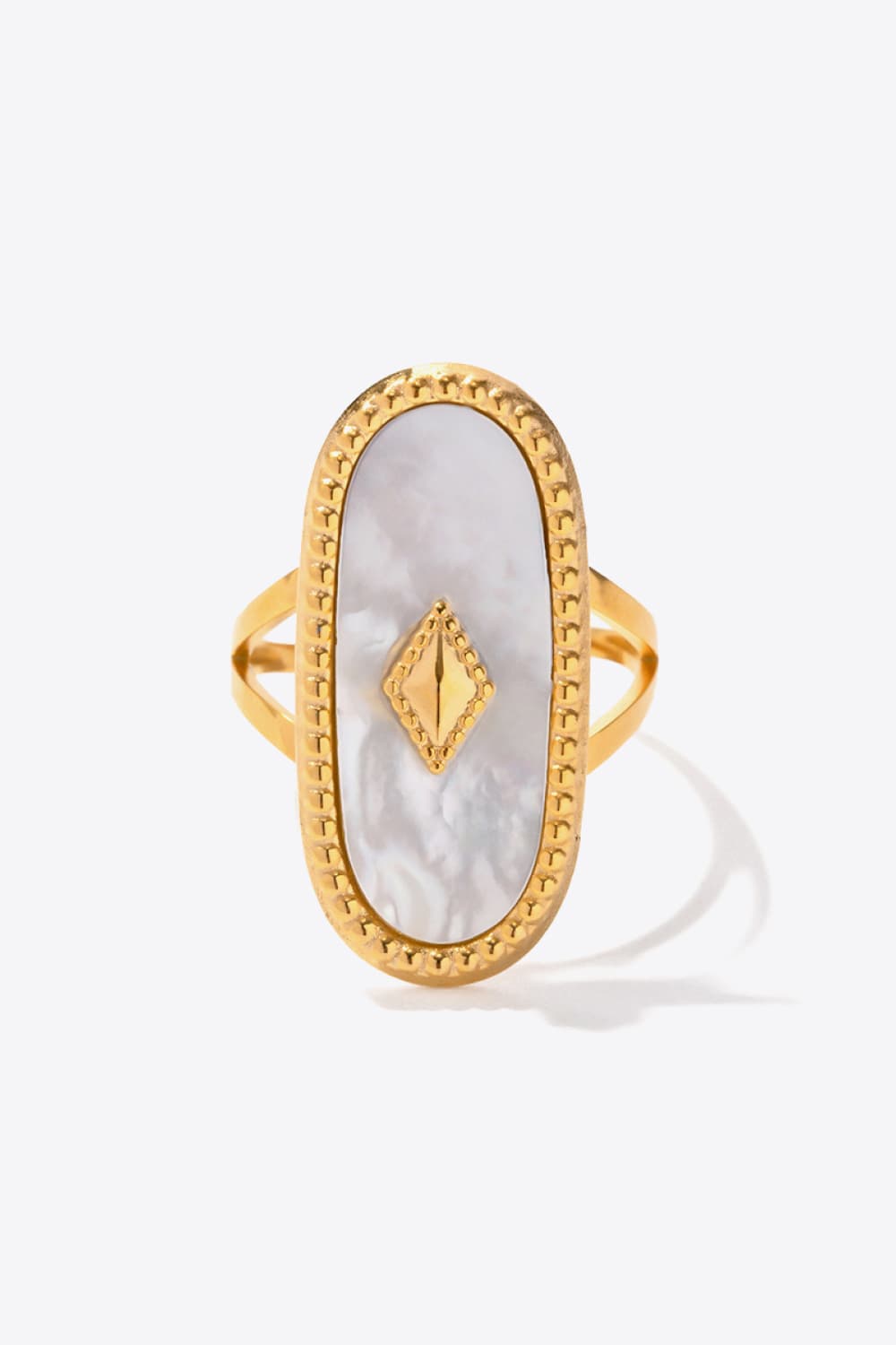 Gold-plated ring with oval mother-of-pearl inlay and diamond accent.