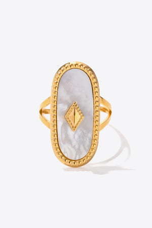 Gold-plated ring with oval mother-of-pearl inlay and diamond accent.