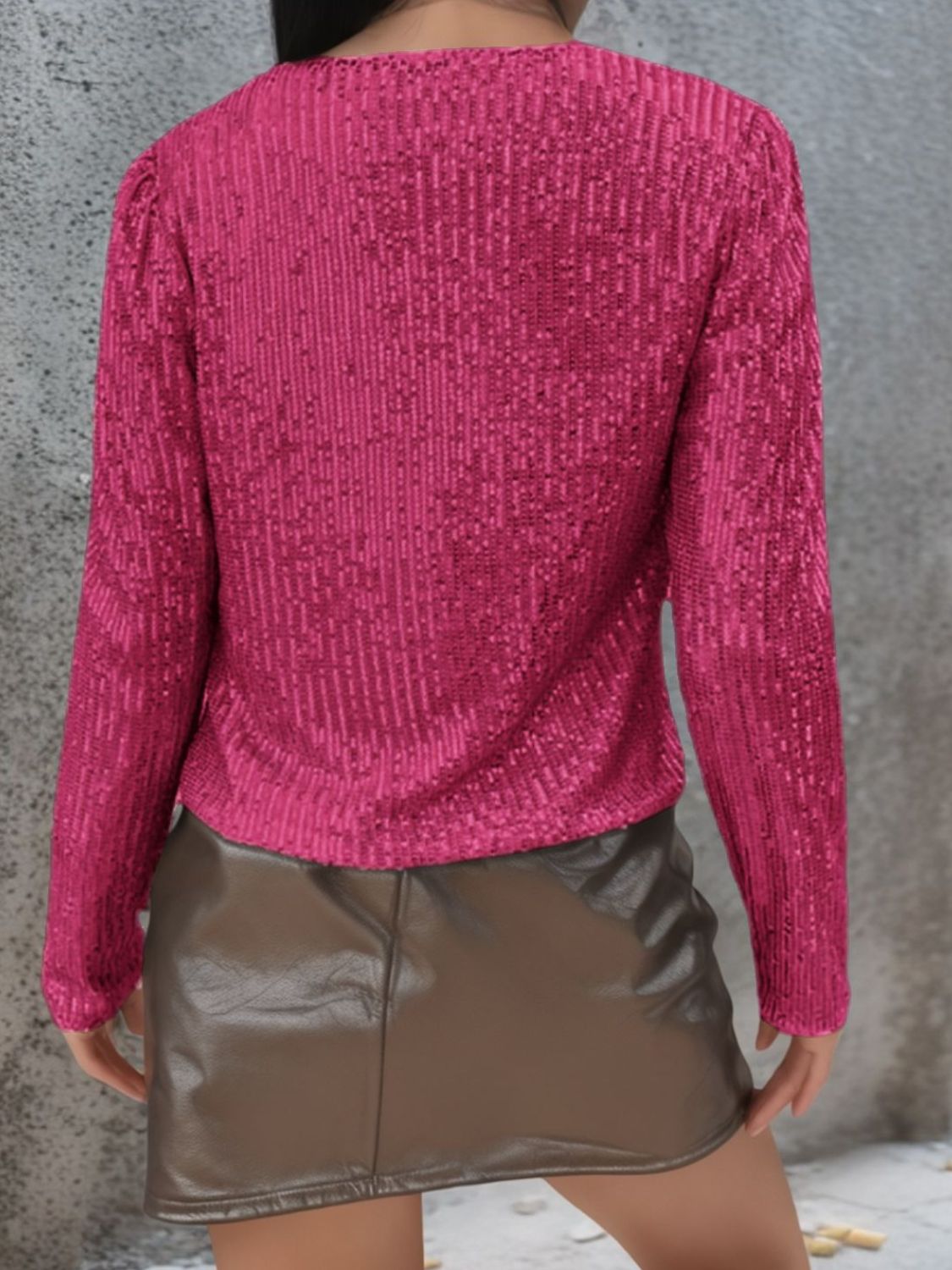 Hot Pink sequin bolero jacket with long sleeves and puffed shoulders.