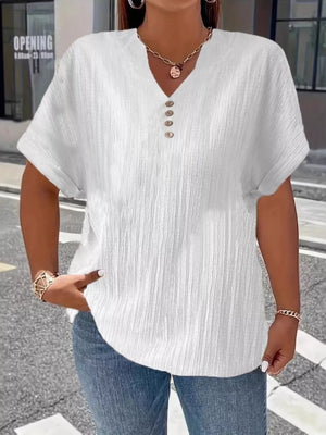 White textured v-neck t-shirt with decorative buttons and short sleeves.