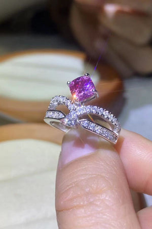 Pink moissanite bow ring with pavé detail in sterling silver