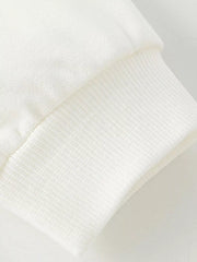 White kids' sweatshirt cuff detail with ribbed texture