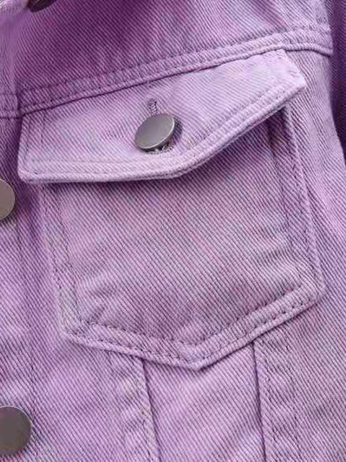 Lavender denim trucker jacket with button flap chest pocket detail.