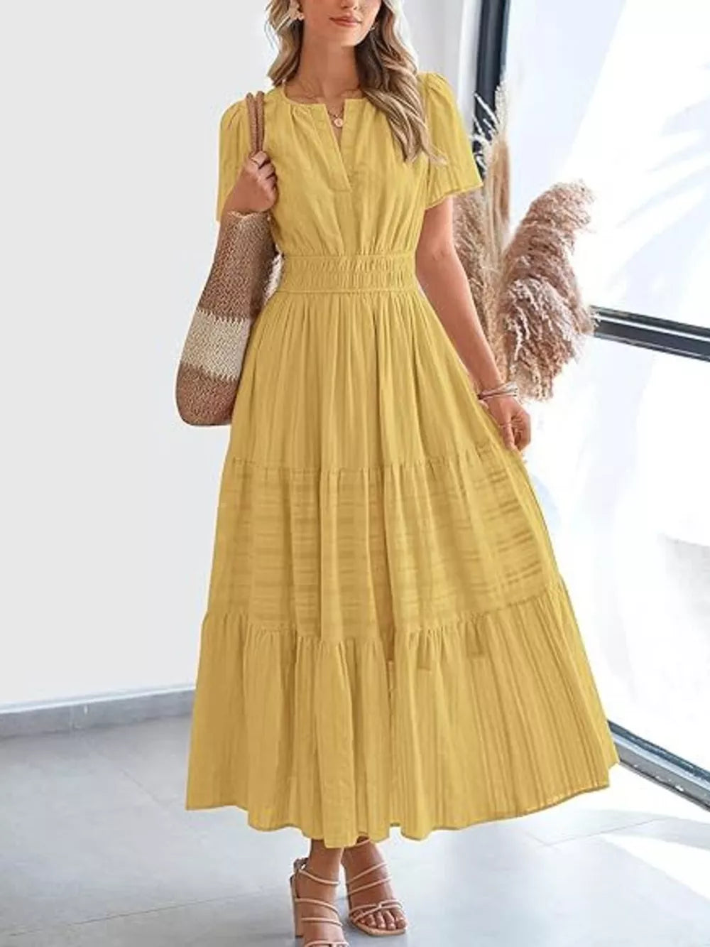 Ruched V-neck tiered midi dress in gold with short sleeves and smocked waist.