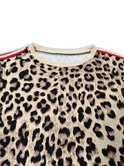 Leopard print maternity one-piece swimsuit in tan with red and white striped trim.