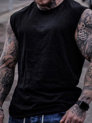 Black muscle-fit sleeveless tank top with crew neck, showing off tattooed arms.