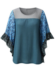 Textured panel blouse in Dusty Blue with gray and floral print flutter sleeves.