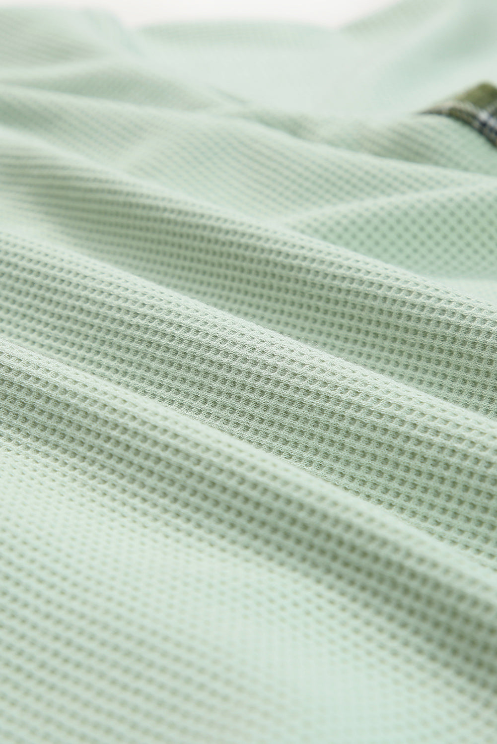 Green waffle knit overshirt with plaid trim detail