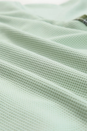 Green waffle knit overshirt with plaid trim detail