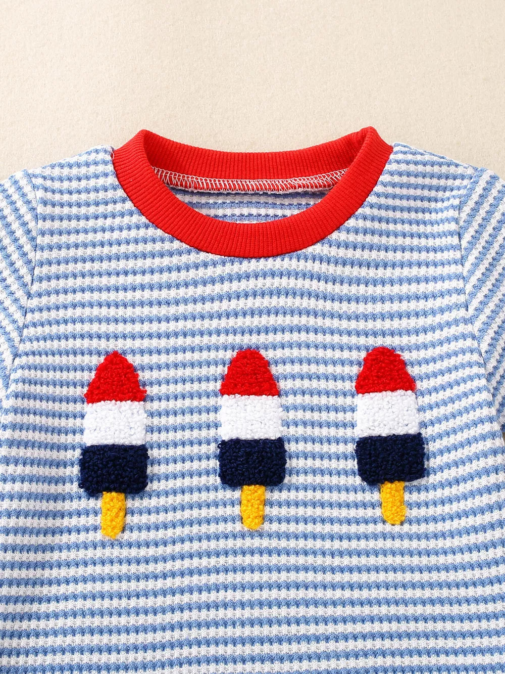 Baby tee with blue and white stripes, red trim, and ice cream appliques.