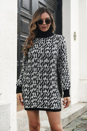 Black houndstooth knit turtleneck mini dress with long sleeves.