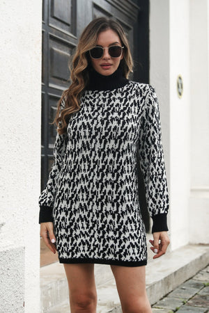 Black houndstooth knit turtleneck mini dress with long sleeves.