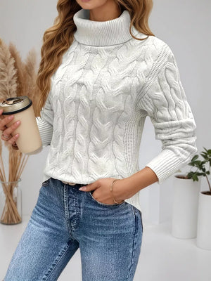 White cable-knit turtleneck sweater with a cozy, comfortable fit.